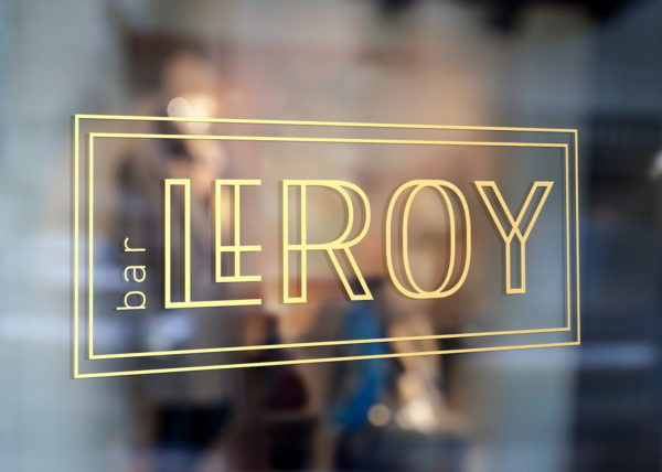 Bar Leroy sign Leakey renovation gold text window